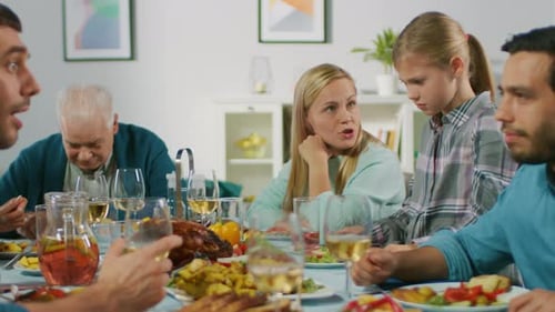 Family gathered around the table for celebration meal