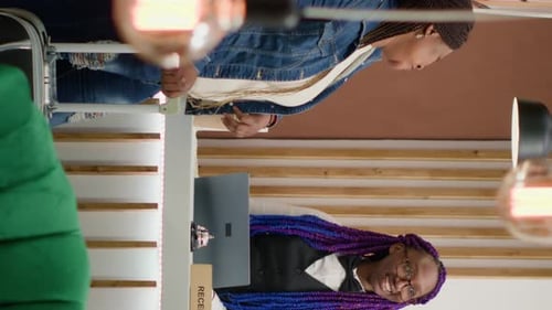 Vertical Video Receptionist Welcoming Guests at Hotel