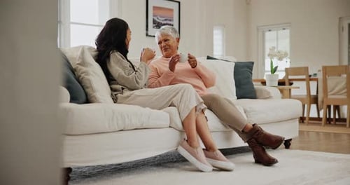 Two Women Chatting and Drinking Coffee at Home