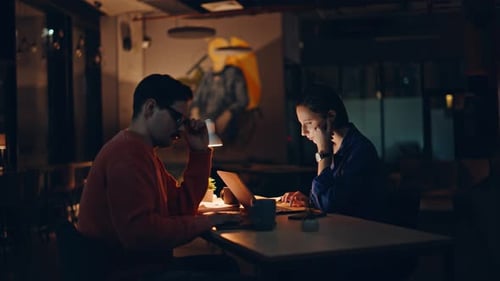 Two Programmers Tired Overtime Work at Dark Workplace Fatigued Workers Evening