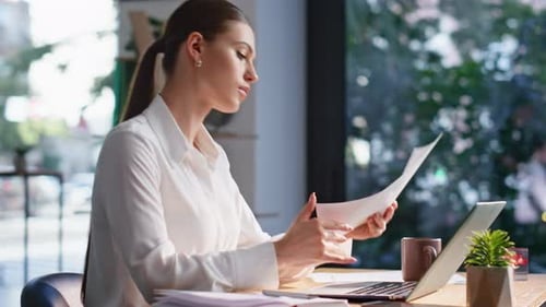 Corporate Specialist Focused Paperwork Sitting Office Closeup Lady Working