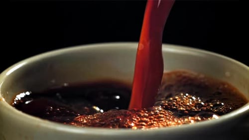 Black Coffee Pours Into a Cup Filmed on a Highspeed Camera at 1000 Fps