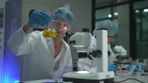 Scientists Conducting Research and Analyzing Samples in Laboratory