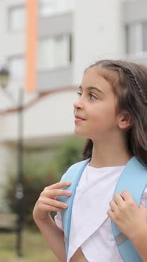 Vertical Video a Girl Carrying Backpacks Going Running to School Education Concept