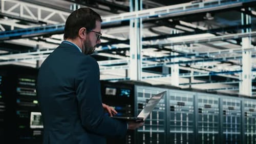 Writing Code Laptop Program and Software Developer in Data Center