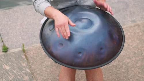 Hands with Hang Drum Close Up Man Practicing Native Music Traditional Drumming Instrument Played