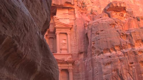 The Ancient Treasury Building Al Khazneh is Seen Framed Between High Rock Walls in the Siq Canyon at