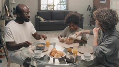 Family Eating Breakfast Together at Home