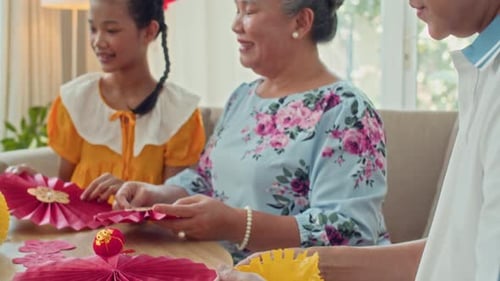 Family Making Decorations at Home Indoors