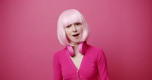 Woman Talks and Gestures With Pink Monochromatic Style