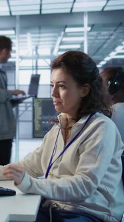 Joyful Technician Working in High Tech Data Center Workspace