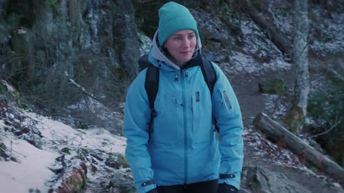 Young woman traveller walking in forest, enjoying nature. Travel adventure