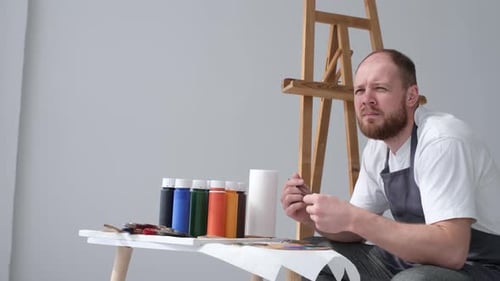 An Artist Works on an Abstract Oil Painting in a Workshop The Concept of Drawing a Picture