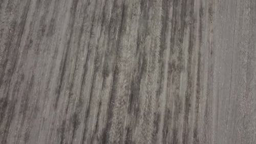 Blue tractor OA working on the field in Ukraine