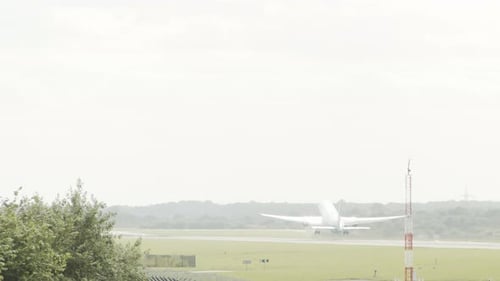 A large airplane takes off from a runway.