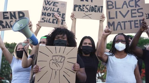 Black lives matter protestors march for equal rights in the city streets