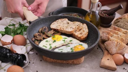 Preparing Fried Eggs with Toast for Delicious Breakfast