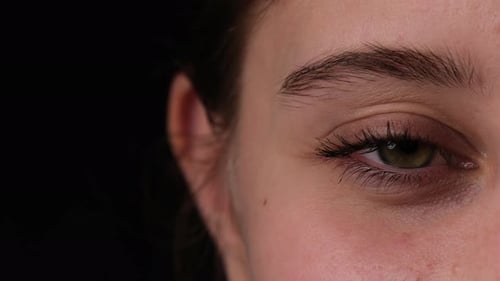 Girl Opens Wide Her Big Eye With Long Eyelashes Close Up