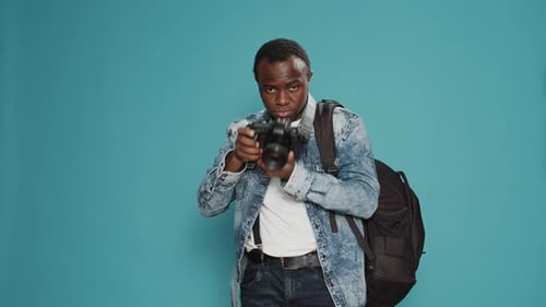 Photographer Smiling and Taking Pictures with Camera