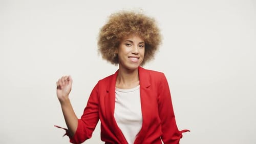 Young Woman Smiles and Makes Peace Sign