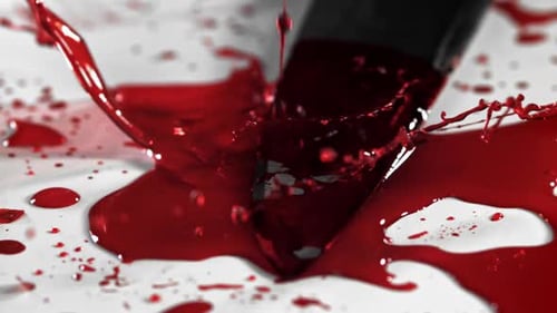 Drops of Blood Fall on the Knife Filmed on a Highspeed Camera at 1000 Fps