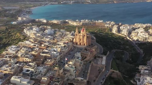 Aerial view of Mellieha Church and coastline, Malta.