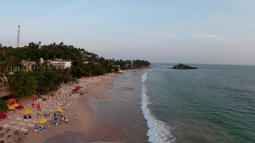 Areal Shot Of Big Wave Splashing Smoothly On Sandy Beach On Sunny Day, Sri Lanka