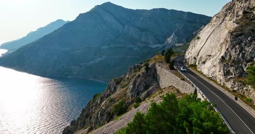 Cars on route D8 in the mountains of the Makarska riviera, Croatia - Aerial view