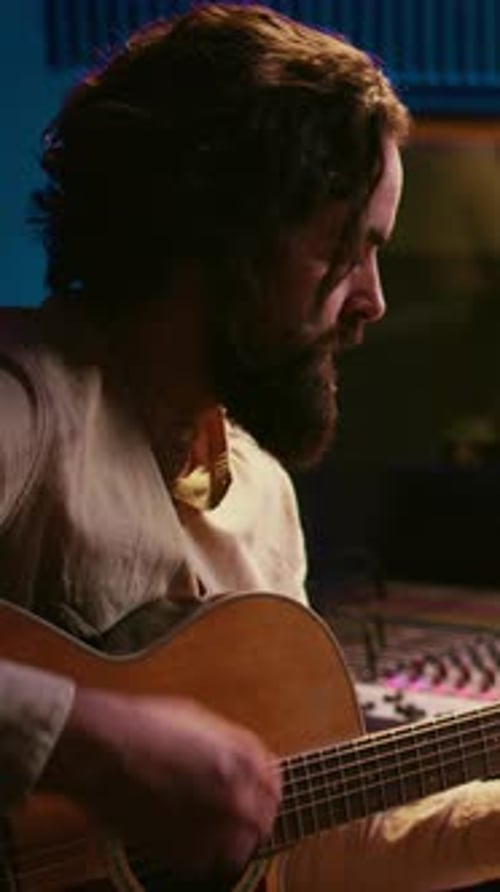 Vertical Video Songwriter Composing a Song with Sound Engineer in Professional Studio