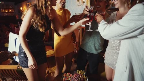 Happy friends celebrating in a cocktail bar