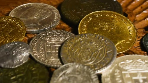 Treasure trove of ancient coins. Silver and gold coins in chest.
