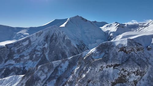 Aerial view of beautiful snowy mountains in Gudauri, Georgia