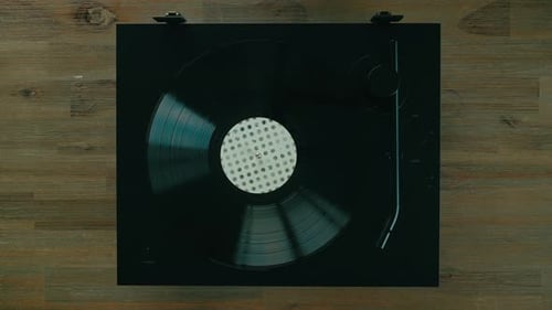 Vinyl Record Spinning on Black Record Player