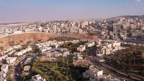 Aerial footage of Israel and Palestine town divided by fence