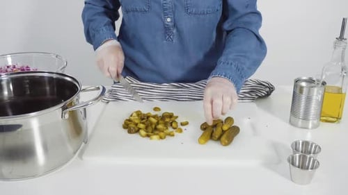 Time Lapse Step By Step Cutting Cookies Vegetables on a White Cutting Board for Vinaigrette Salad