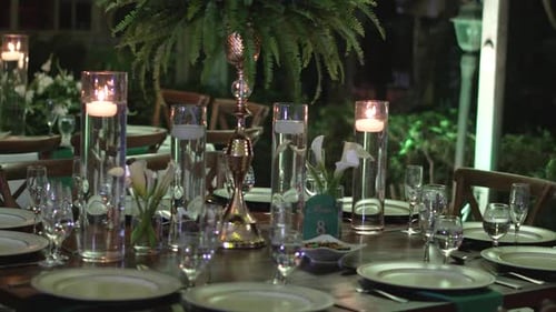 Elegant Wedding Table Setting with Candles and Flowers