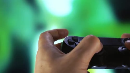 Closeup of Hands Using Controller Playing Video Games