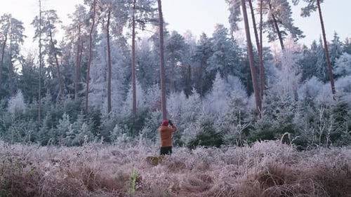 Photographer in Winter Forest - daylight - wide