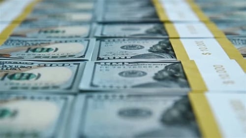 Bundles Of One Hundred USA Dollar Banknotes Tied With An Paper Band. Banking And Finance Concept.