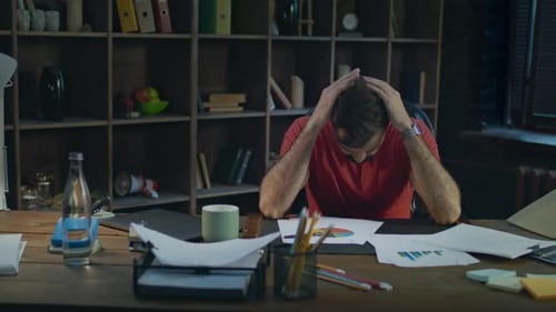 Upset Business Man Putting Hands on Head. Depressed Man Thinking About Business