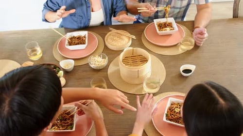Friends and Family Sharing a Meal Together