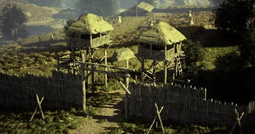 A Rustic Wooden Fortification Features Two Lookout Towers on Elevated Grounds