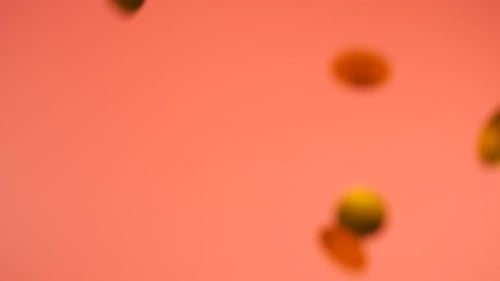 Abstract Confetti Falling on a Pink Background