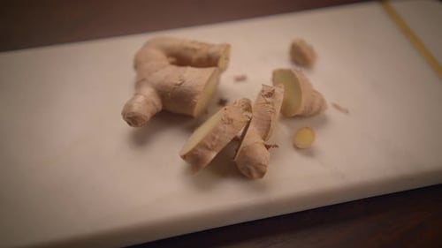 Fresh Ginger Root Displayed on a Wooden Cutting Board Perfect for Cooking and Health Benefits