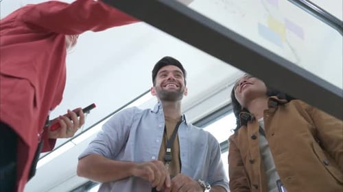 Team Brainstorms Ideas Together in Modern Office