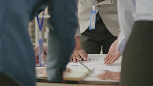 Close up of business hands are working and brainstorming on paperworks.