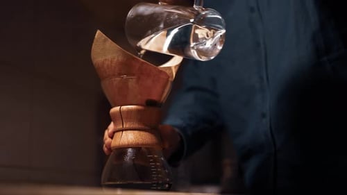 Pouring Water into Coffee Maker