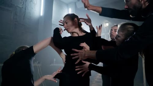 Dancers Performing Abstract Group Performance in Urban Studio