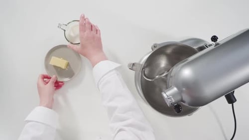 Flat Lay Mixing Ingredients in a Kitchen Standing Mixer to Bake Cinnamon Rolls