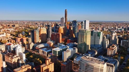 Flying above the multi-storied buildings in the panorama of New York.
